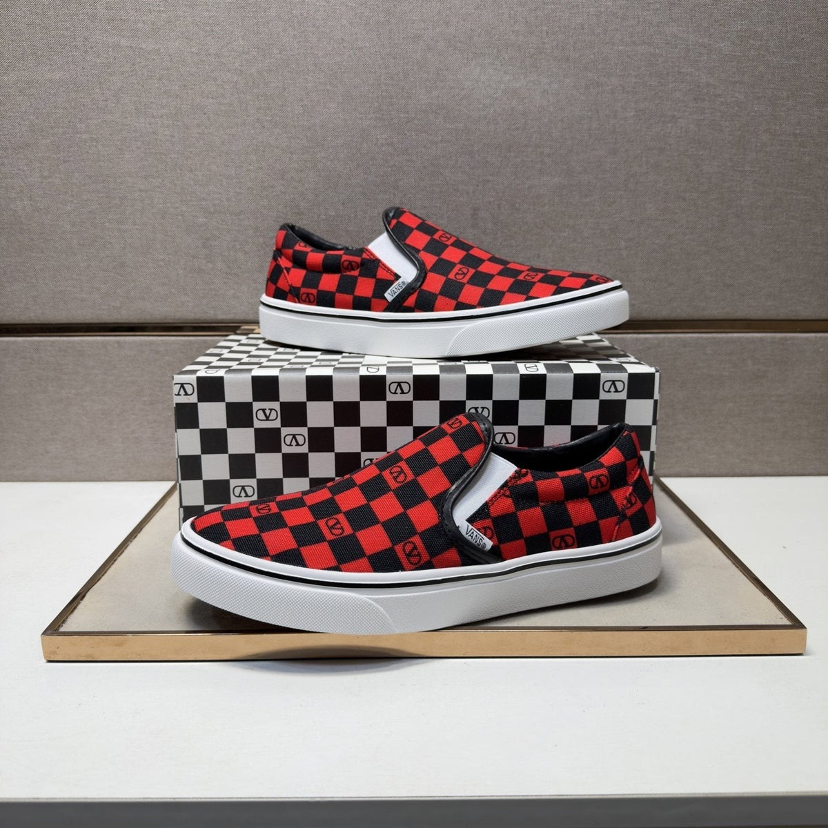 Vans Red and Black Checkerboard Slip-On Sneakers
